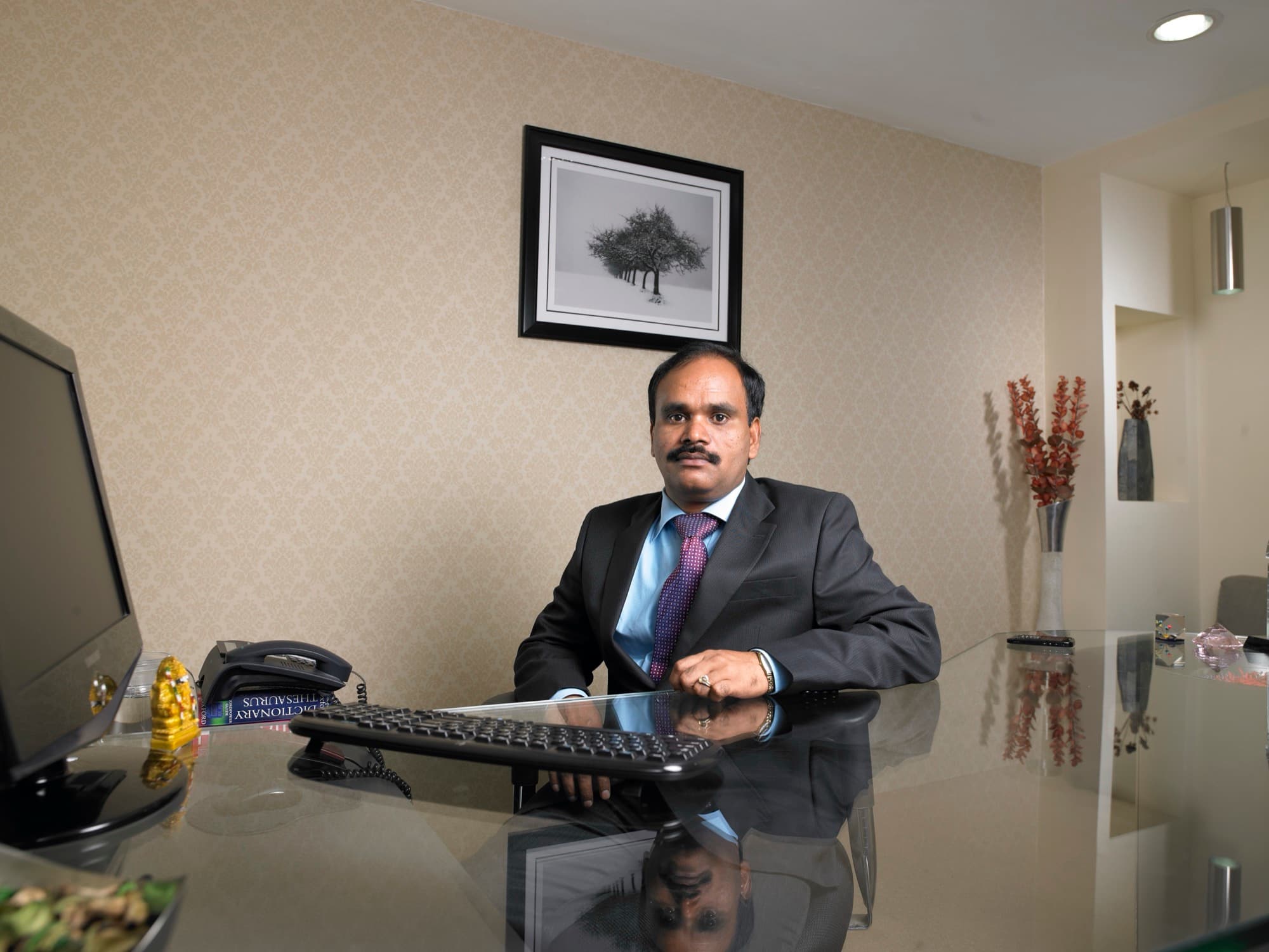 The Managing Director of KMS Pharma at his desk